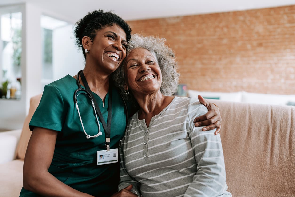 A home care healthcare professional hugging a patient